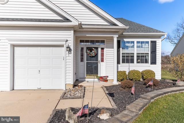 view of exterior entry featuring a garage