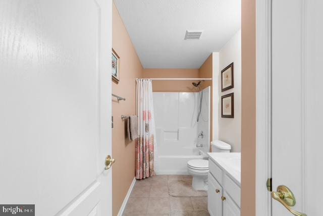 full bathroom featuring tile patterned floors, shower / bathtub combination with curtain, vanity, and toilet