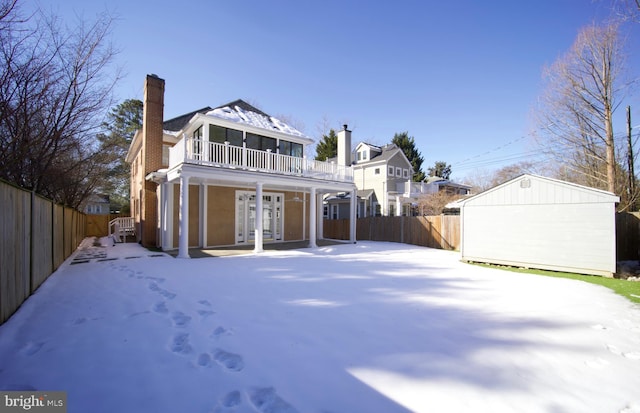 view of snow covered house