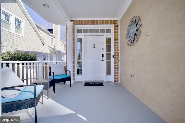 doorway to property with covered porch