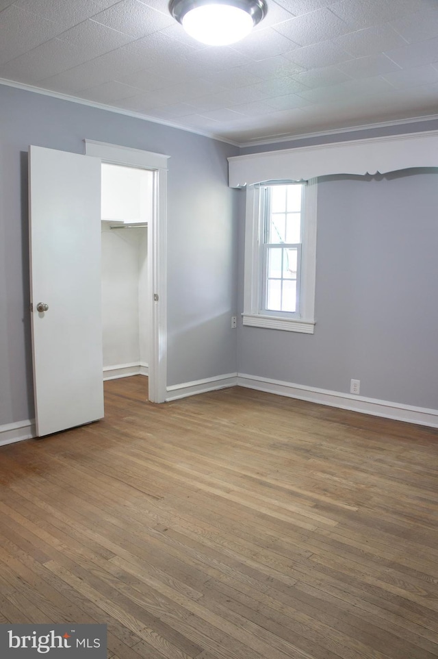 empty room featuring hardwood / wood-style flooring