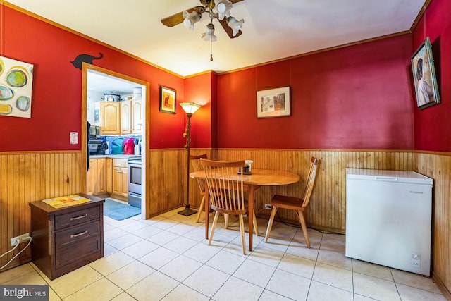 dining space with ceiling fan and light tile patterned floors