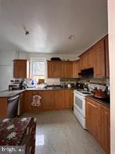 kitchen with white stove and extractor fan