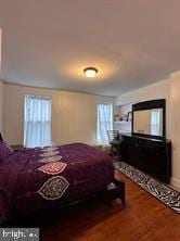 bedroom with wood-type flooring