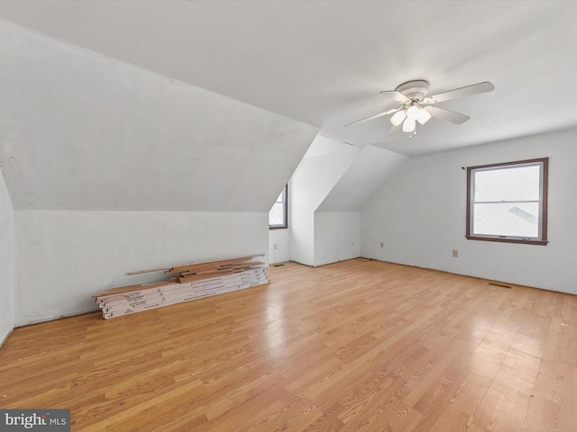 bonus room with ceiling fan, light wood-type flooring, and lofted ceiling