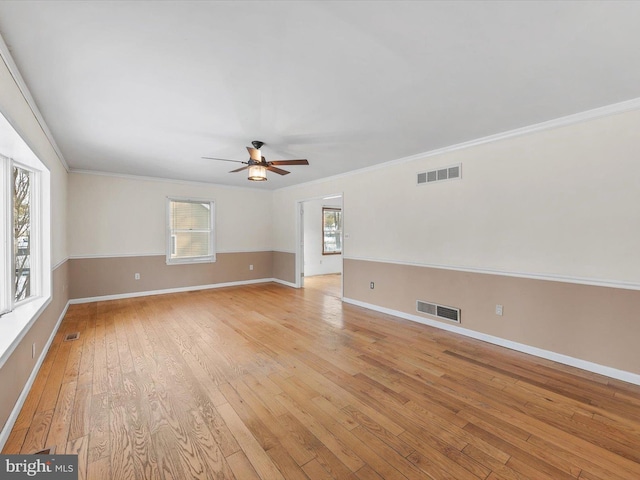 unfurnished room with ceiling fan, crown molding, and light hardwood / wood-style floors