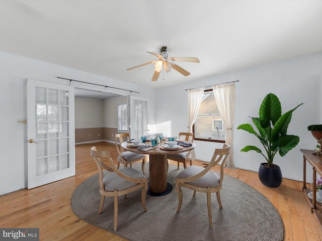 dining area featuring ceiling fan, light hardwood / wood-style flooring, and french doors