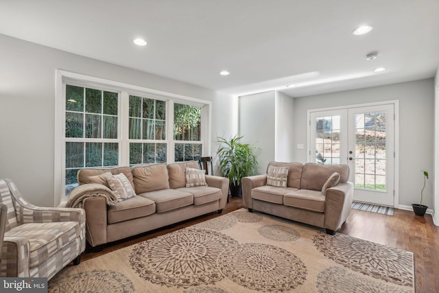 living room with hardwood / wood-style floors and french doors