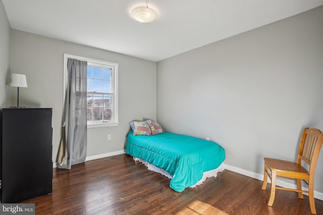 bedroom featuring dark wood-type flooring