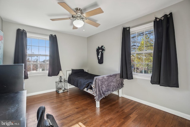 bedroom featuring hardwood / wood-style floors and ceiling fan