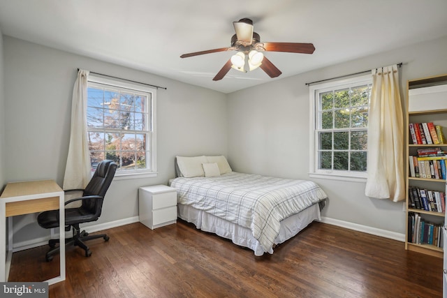 bedroom featuring dark hardwood / wood-style floors and ceiling fan