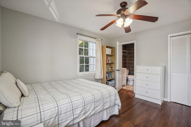 bedroom featuring ceiling fan, dark hardwood / wood-style floors, ensuite bath, and a closet