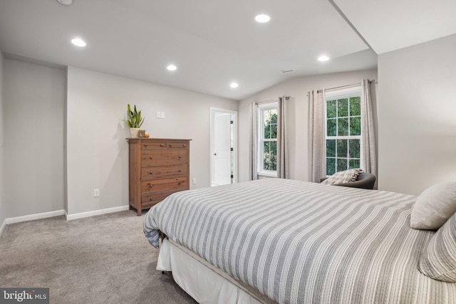 carpeted bedroom featuring vaulted ceiling