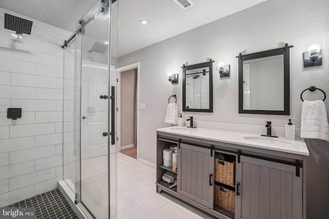 bathroom with tile patterned flooring, vanity, and a shower with shower door