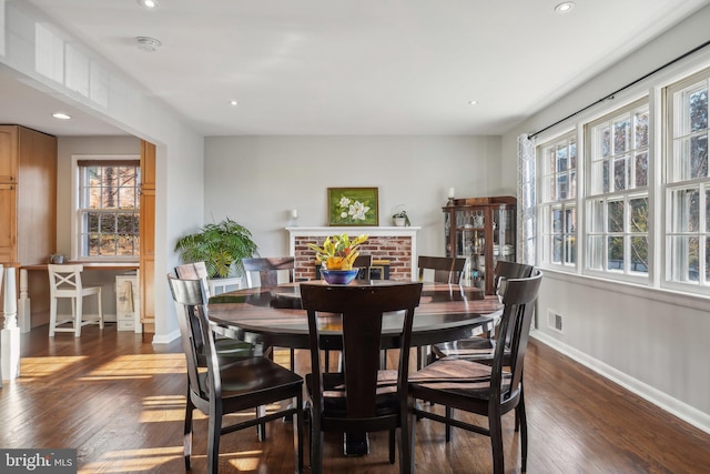 dining room with dark hardwood / wood-style flooring