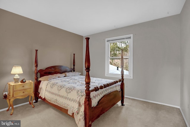 bedroom with light colored carpet