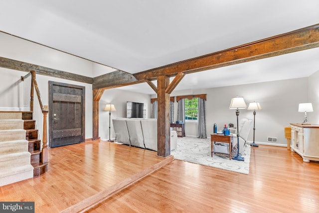 unfurnished living room featuring light wood-type flooring