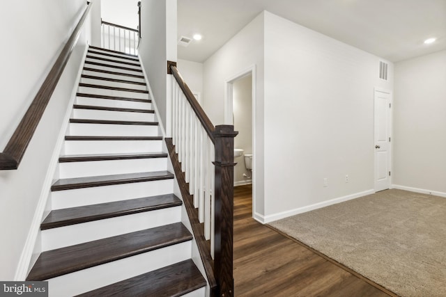 stairway with wood-type flooring