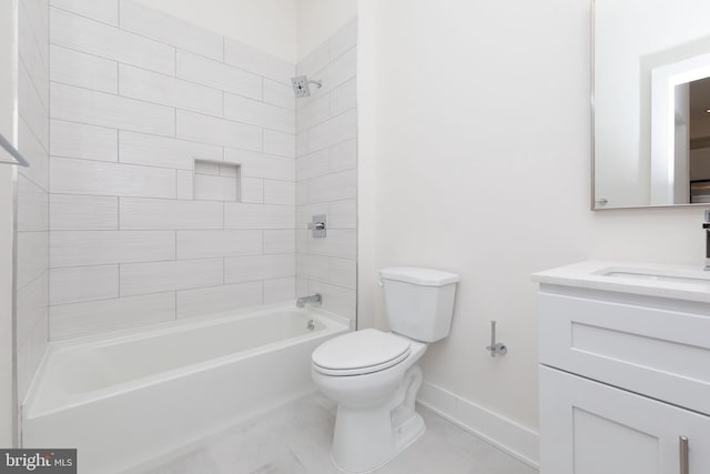 full bathroom featuring vanity, tiled shower / bath combo, and toilet