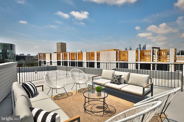 view of patio / terrace with a balcony and an outdoor hangout area