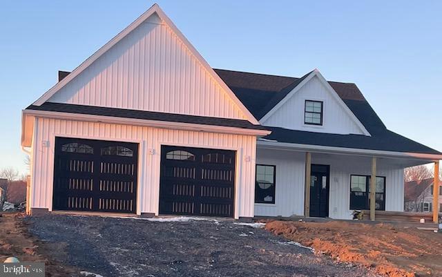 view of front of house with a garage and covered porch