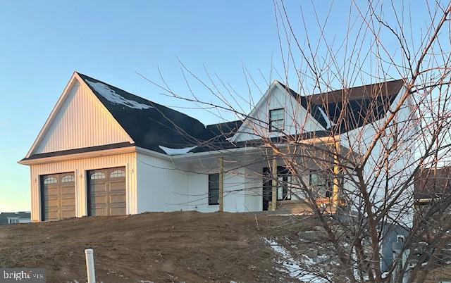 view of property exterior featuring a garage