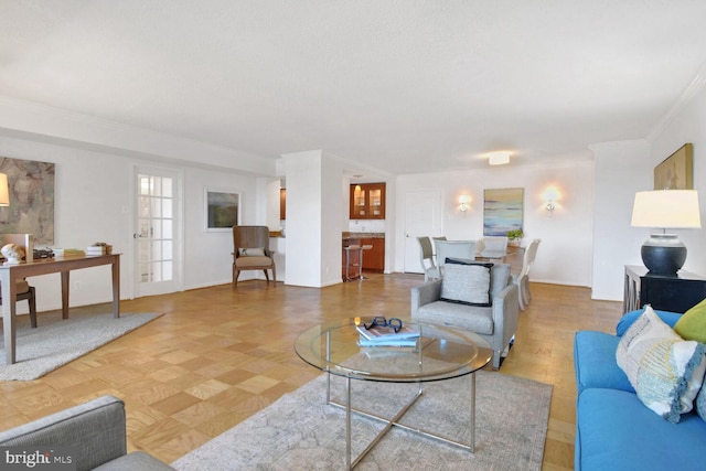 living room with ornamental molding