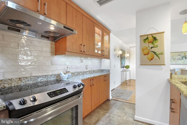 kitchen featuring tasteful backsplash, hanging light fixtures, light stone counters, and stainless steel range with electric stovetop