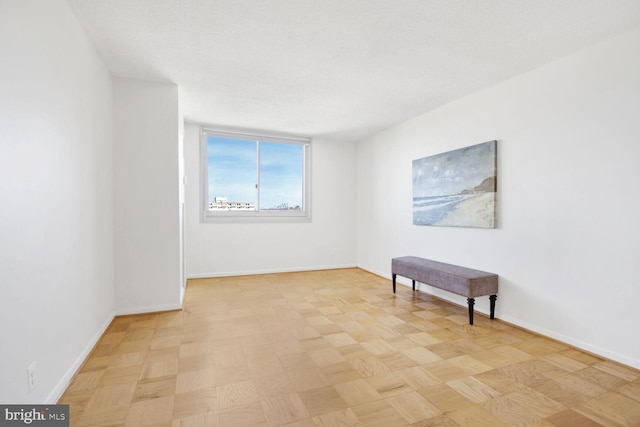 empty room with a textured ceiling