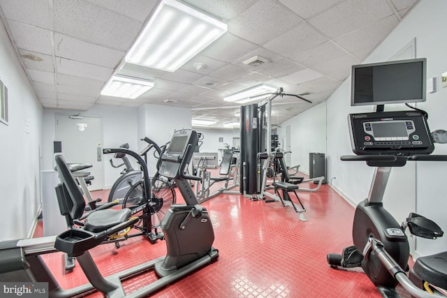 workout area featuring a paneled ceiling