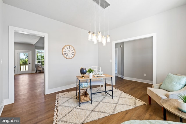 dining space featuring dark wood-type flooring