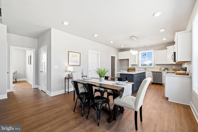 dining space with light wood-type flooring