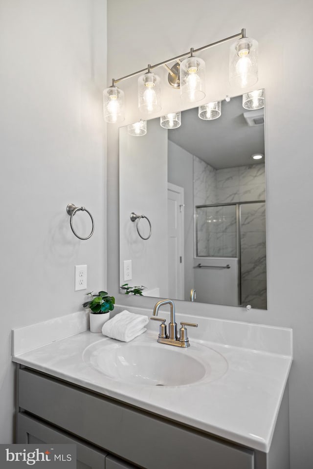 bathroom with vanity and walk in shower