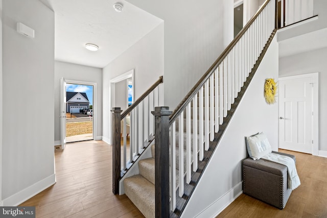 staircase featuring hardwood / wood-style floors