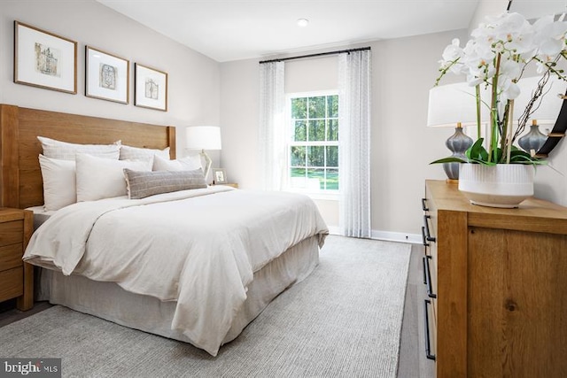 bedroom with hardwood / wood-style flooring