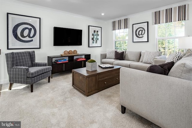 carpeted living room with a wealth of natural light and ornamental molding