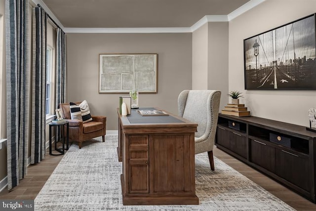 office featuring ornamental molding and light hardwood / wood-style flooring