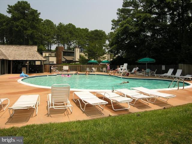 39281 Piney Dr Unit 55115, Bethany Beach, DE 19930 - pool featuring fence and a patio