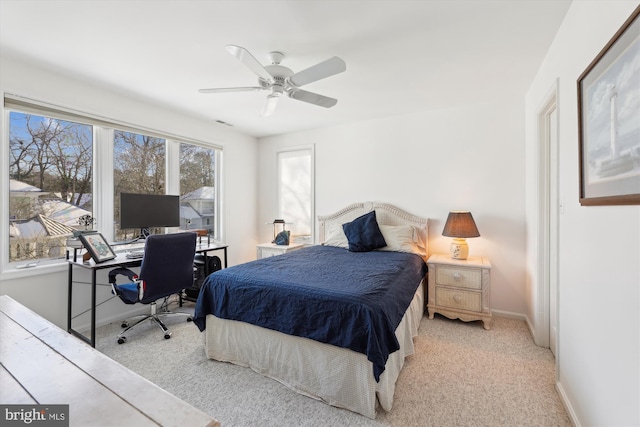 carpeted bedroom featuring ceiling fan