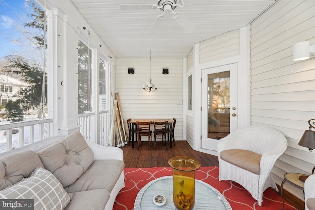 sunroom / solarium with ceiling fan