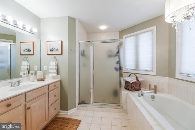 bathroom with tile patterned flooring, shower with separate bathtub, and vanity