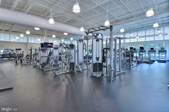 39281 Piney Dr Unit 55115, Bethany Beach, DE 19930 - gym featuring a towering ceiling