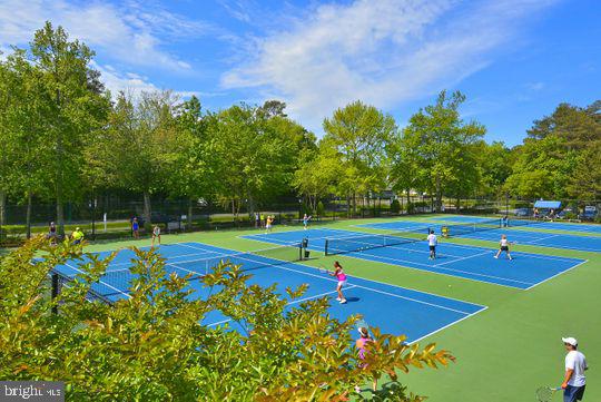 39281 Piney Dr Unit 55115, Bethany Beach, DE 19930 - view of tennis court featuring fence and community basketball court