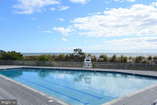39281 Piney Dr Unit 55115, Bethany Beach, DE 19930 - pool with fence