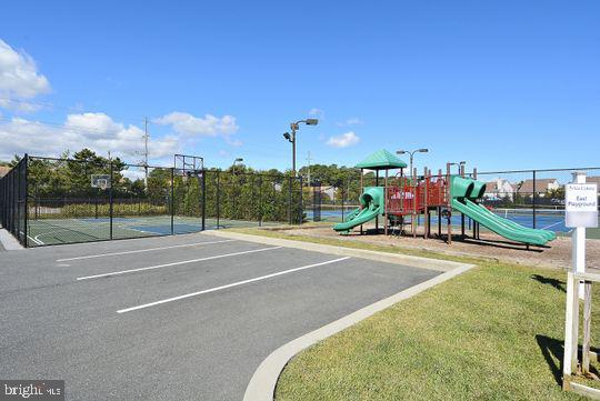 39281 Piney Dr Unit 55115, Bethany Beach, DE 19930 - community jungle gym with fence, community basketball court, and a yard