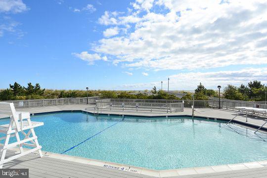 39281 Piney Dr Unit 55115, Bethany Beach, DE 19930 - pool with fence