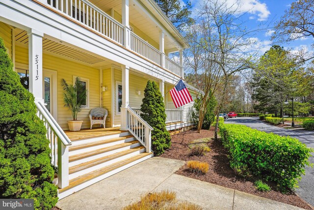 39281 Piney Dr Unit 55115, Bethany Beach, DE 19930 - view of exterior entry featuring a porch and a balcony