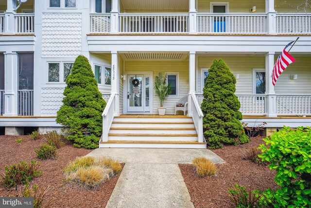 39281 Piney Dr Unit 55115, Bethany Beach, DE 19930 - view of exterior entry featuring a balcony and covered porch