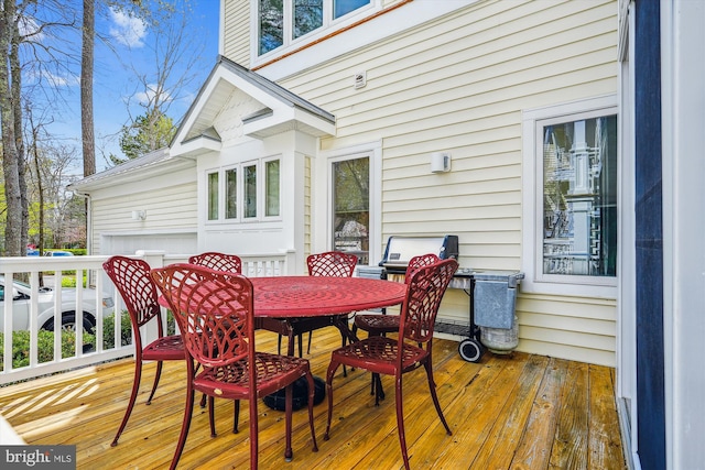 39281 Piney Dr Unit 55115, Bethany Beach, DE 19930 - deck with outdoor dining area and a garage
