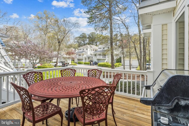 39281 Piney Dr Unit 55115, Bethany Beach, DE 19930 - wooden terrace featuring grilling area, a residential view, and outdoor dining space